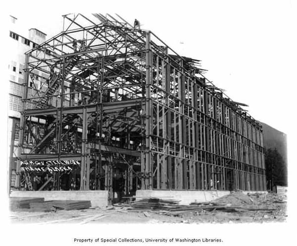 Image of steel frame building, black and white.