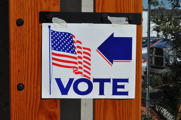 A sign welcoming voters to a polling place.